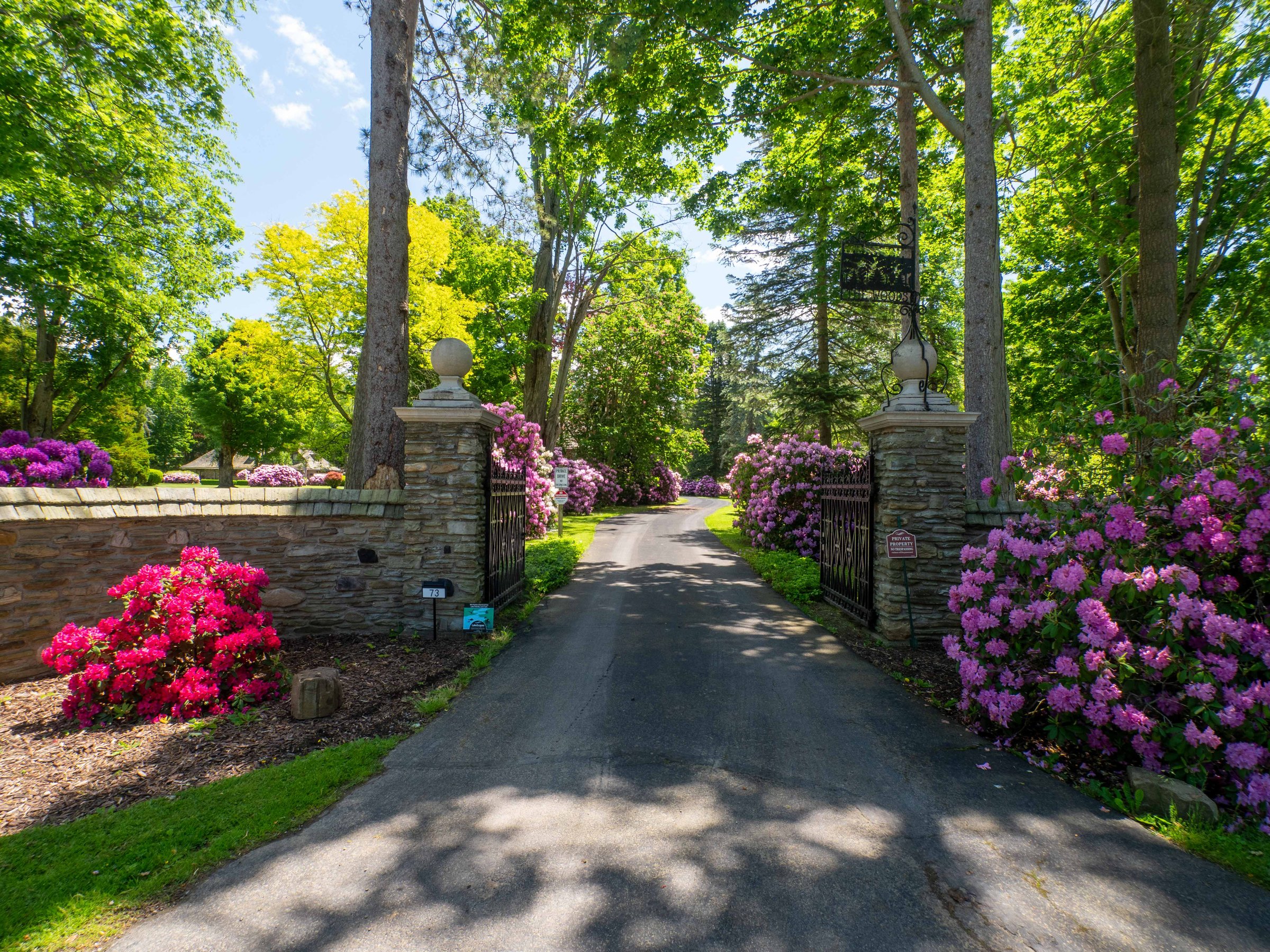Stone gate entrance to The Woods at Bemus Point